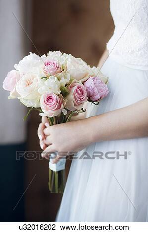 Hands of bride holding bouquet View Large Photo Image Stock Image - Hands of bride holding bouquet. Fotosearch