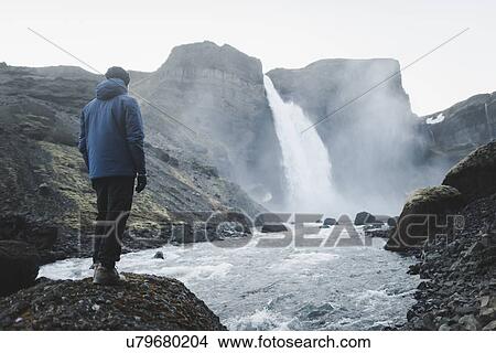 Hiker by Haifoss waterfall in Iceland View Large Photo Image Picture - Hiker by Haifoss waterfall in Iceland. Fotosearch