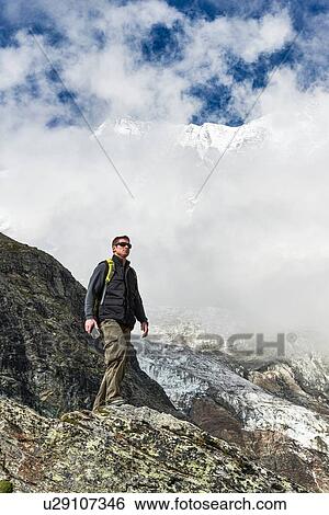 Hiker enjoying walk, Saas-Fee, Valais, Switzerland View Large Photo Image Stock Photograph - Hiker enjoying walk, Saas-Fee, Valais, Switzerland. Fotosearch