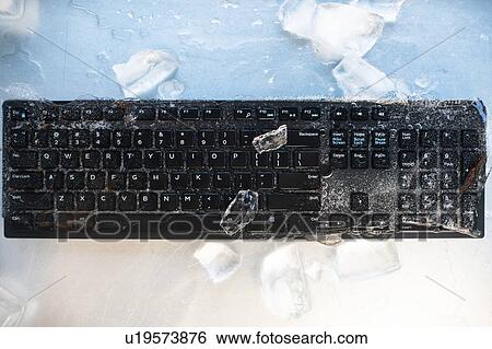 Stock Photograph - Ice on computer keyboard. Fotosearch