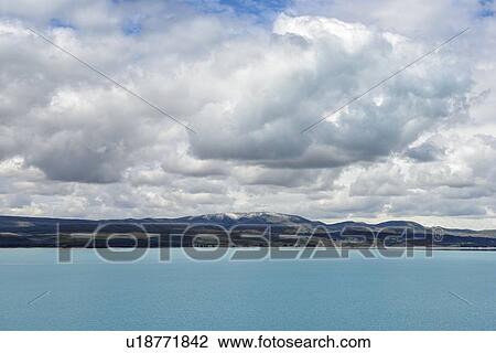 Stock Image - Lake Pukaki under cloudscape in Pukaki, New Zealand. Fotosearch