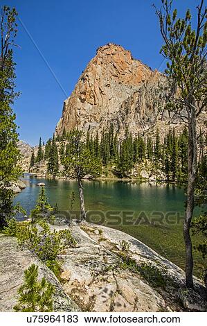 Lake under rock mountain in Stanley, Idaho, USA View Large Photo Image Stock Image - Lake under rock mountain in Stanley, Idaho, USA. Fotosearch