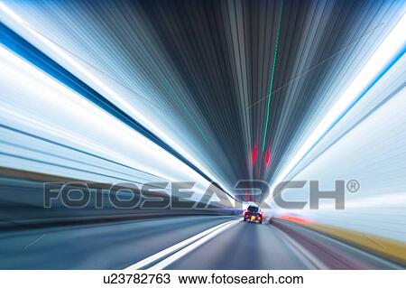 Stock Image - Long exposure of car in tunnel. Fotosearch