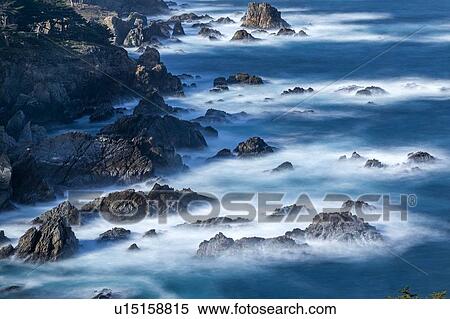 Stock Photography - Long exposure shot of rocks in sea at Carmel-by-the-Sea, California, USA. Fotosearch