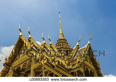 Stock Image - Low angle view of Wat Phra Kaew in Bangkok, Thailand. Fotosearch
