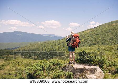 Man hiking in the Carpathian Mountain Range View Large Photo Image Stock Photo - Man hiking in the Carpathian Mountain Range. Fotosearch