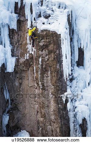 Man ice climbing in Ouray, USA View Large Photo Image Stock Photo - Man ice climbing in Ouray, USA. Fotosearch