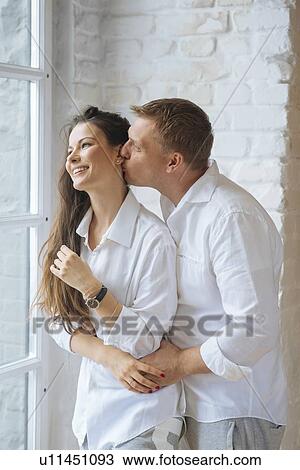 Man kissing wife's cheek View Large Photo Image Stock Image - Man kissing wife's cheek. Fotosearch