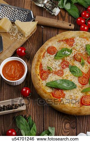 Margherita pizza with ingredients View Large Photo Image Stock Photograph - Margherita pizza with ingredients. Fotosearch