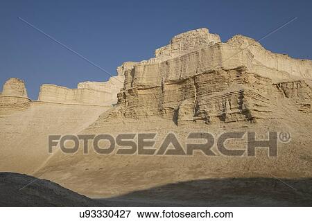 Stock Photo - Marl stone formations. Eroded cliffs made of marl, a calcium carbonate-rich, mudstone formed from sedimentary deposits. Photographed in the Dead Sea region of Israel.. Fotosearch