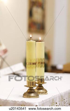 Stock Image - Matching candles at wedding. Fotosearch