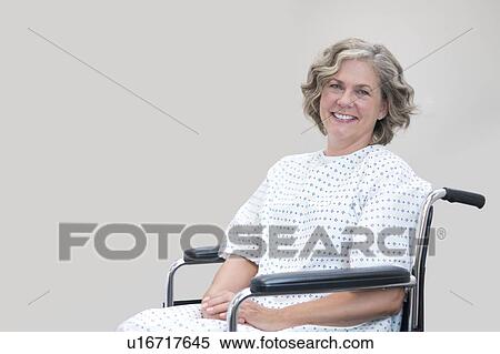 Mature female patient in wheelchair. View Large Photo Image Stock Photography - Mature female patient in wheelchair.. Fotosearch