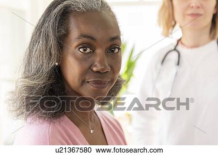 Mature woman and nurse View Large Photo Image Stock Image - Mature woman and nurse. Fotosearch