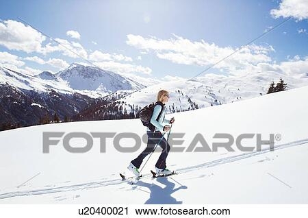 Mature woman snowshoeing up snow covered mountainside, Styria, Tyrol, Austria View Large Photo Image Stock Image - Mature woman snowshoeing up snow covered mountainside, Styria, Tyrol, Austria. Fotosearch