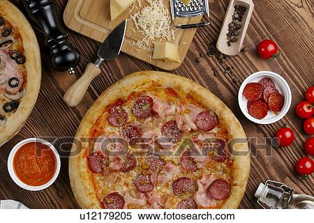 Stock Photography - Meat pizza with ingredients. Fotosearch