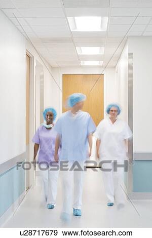 Medical staff walking down hospital corridor. View Large Photo Image Stock Photo - Medical staff walking down hospital corridor.. Fotosearch