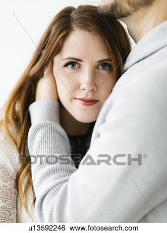 Mid adult woman in man's embrace View Large Photo Image Stock Photograph - Mid adult woman in man's embrace. Fotosearch
