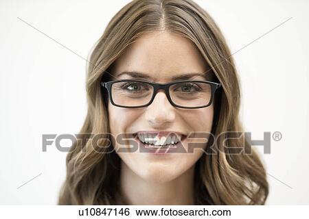 Mid adult woman wearing glasses, studio shot. View Large Photo Image Stock Photograph - Mid adult woman wearing glasses, studio shot.. Fotosearch