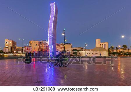 Modern sculpture in town square at sunset in Dakhla, Morocco View Large Photo Image Stock Photo - Modern sculpture in town square at sunset in Dakhla, Morocco. Fotosearch
