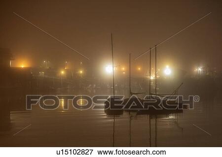 Moored sailboats at night View Large Photo Image Stock Photo - Moored sailboats at night. Fotosearch