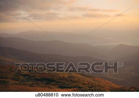 Mountains at sunrise at the Carpathian Mountain Range in Ukraine View Large Photo Image Stock Image - Mountains at sunrise at the Carpathian Mountain Range in Ukraine. Fotosearch