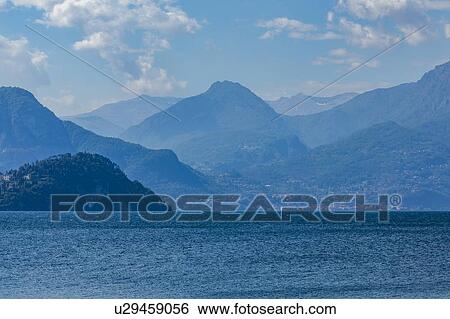 Stock Photograph - Mountains by Lake Como in Lombardy, Italy. Fotosearch
