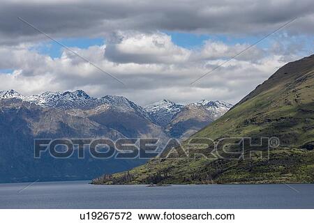 Mountains by Lake Wakatipu near Queenstown, New Zealand View Large Photo Image Stock Image - Mountains by Lake Wakatipu near Queenstown, New Zealand. Fotosearch