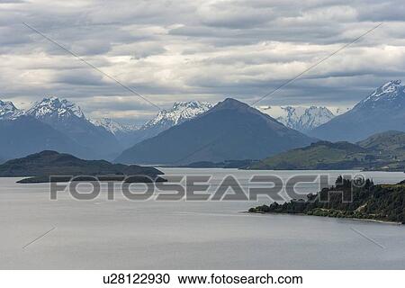 Stock Image - Mountains by Lake Wakatipu near Queenstown, New Zealand. Fotosearch