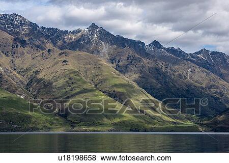 Stock Photo - Mountains by Lake Wakatipu near Queenstown, New Zealand. Fotosearch