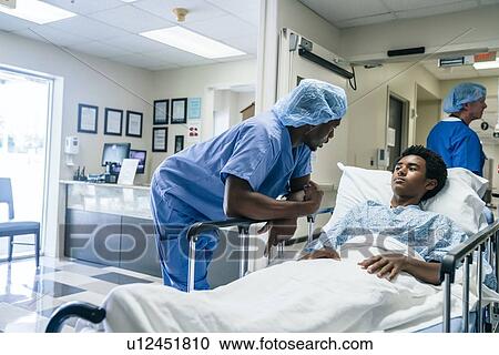 Nurse talking to teenage patient View Large Photo Image Stock Image - Nurse talking to teenage patient. Fotosearch