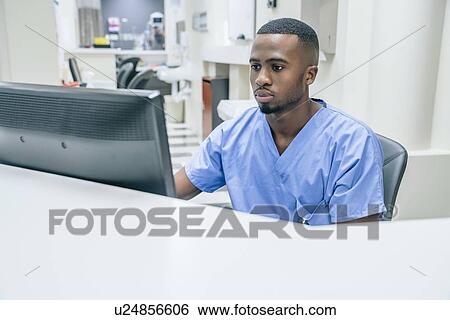 Nurse using computer in hospital View Large Photo Image Stock Photograph - Nurse using computer in hospital. Fotosearch