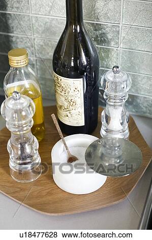 Oil, salt and pepper on tray in kitchen View Large Photo Image Stock Photo - Oil, salt and pepper on tray in kitchen. Fotosearch