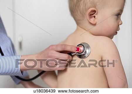 Stock Photo - Paediatrician using stethoscope on girl. Fotosearch