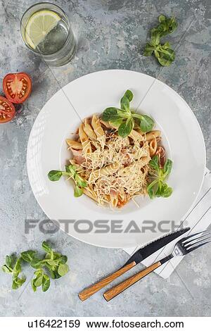 Pasta topped with cheese and basil View Large Photo Image Stock Photo - Pasta topped with cheese and basil. Fotosearch