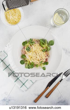 Pasta topped with cheese and basil View Large Photo Image Stock Photograph - Pasta topped with cheese and basil. Fotosearch