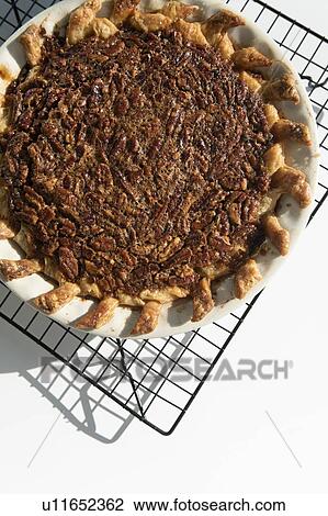 Stock Image - Pecan pie on cooling rack. Fotosearch