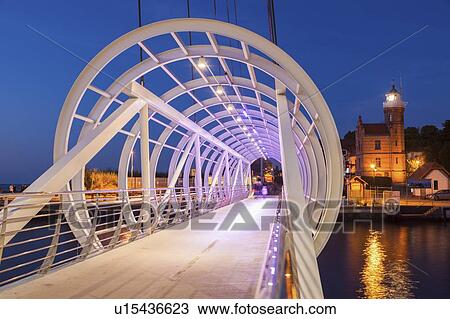 Stock Image - Pedestrian bridge in Ustka, Poland. Fotosearch