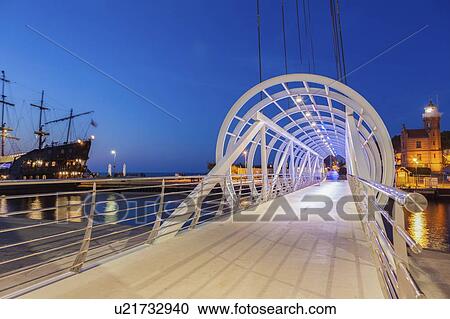 Stock Image - Pedestrian bridge in Ustka, Poland. Fotosearch