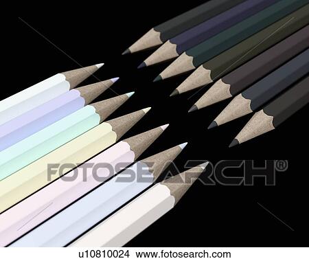 Picture - Pencils in opposing light and dark shades pointing at each other. Computer generated image.. Fotosearch