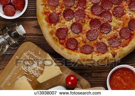Pepperoni pizza with ingredients View Large Photo Image Stock Photo - Pepperoni pizza with ingredients. Fotosearch