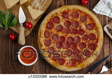 Pepperoni pizza with ingredients View Large Photo Image Stock Photograph - Pepperoni pizza with ingredients. Fotosearch