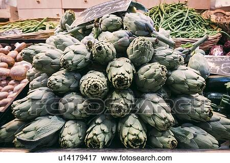 Stock Photo - Pile of artichokes in greengrocer's. Fotosearch