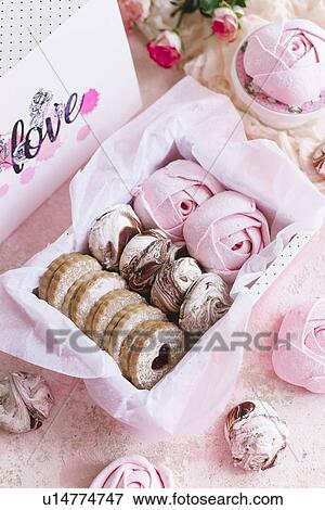 Stock Photo - Pink box of biscuits and candy. Fotosearch