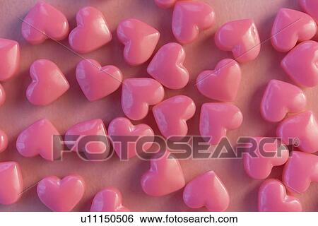 Pink heart shaped candy View Large Photo Image Stock Photograph - Pink heart shaped candy. Fotosearch