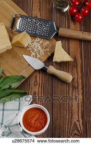 Pizza ingredients on wooden table View Large Photo Image Picture - Pizza ingredients on wooden table. Fotosearch