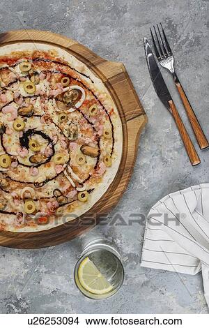 Pizza topped with olives and swirl of sauce View Large Photo Image Picture - Pizza topped with olives and swirl of sauce. Fotosearch