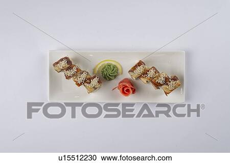 Plate of sushi with pickled ginger and wasabi View Large Photo Image Stock Image - Plate of sushi with pickled ginger and wasabi. Fotosearch