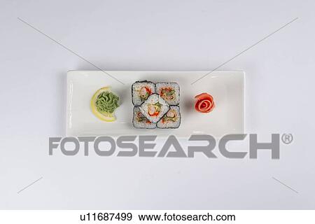 Stock Photo - Plate of sushi with pickled ginger and wasabi. Fotosearch