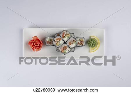 Plate of sushi with pickled ginger and wasabi View Large Photo Image Stock Photo - Plate of sushi with pickled ginger and wasabi. Fotosearch