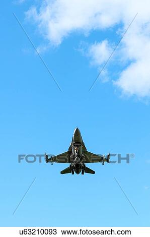 Polish F-16 fighter plane taking part in NATO exercise Frysian flag, low angle against blue sky, Netherlands View Large Photo Image Stock Image - Polish F-16 fighter plane taking part in NATO exercise Frysian flag, low angle against blue sky, Netherlands. Fotosearch